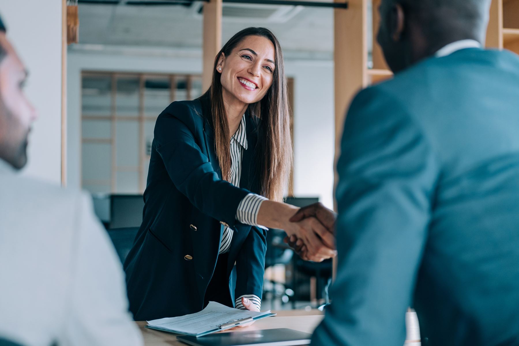 Woman and man shaking hands in agreement